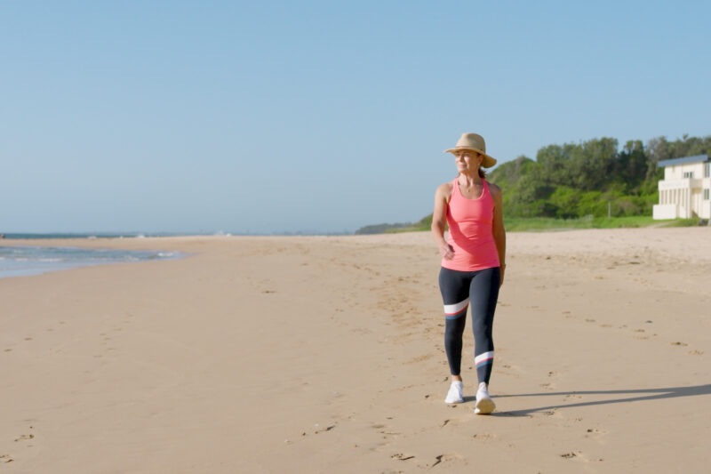 Deb Hutton 01 Conquering Skin Cancer Copyright Moonshine Hat Walking on Beach